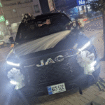 Elegant JAC Car Floral Decor with White Net & Mixed Roses