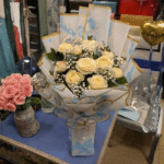 White 🤍 Cream Rose Bouquet in Blue Cloud Wrap