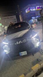 Elegant JAC Car Floral Decor with White Net & Mixed Roses - Image 3