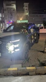 Elegant JAC Car Floral Decor with White Net & Mixed Roses - Image 2